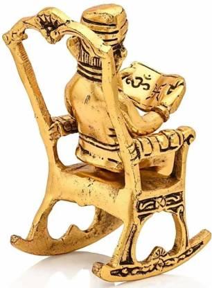 Golden Lord Ganesha Sitting On A Rocking Chair