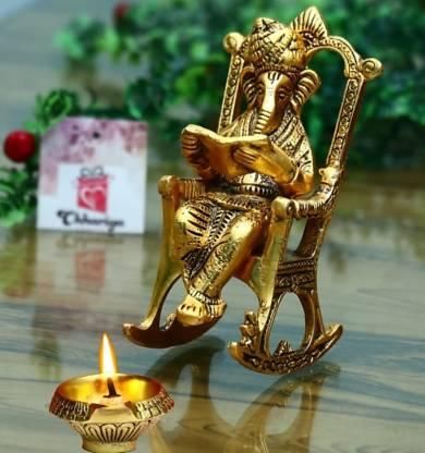 Golden Lord Ganesha Sitting On A Rocking Chair