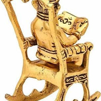 Golden Lord Ganesha Sitting On A Rocking Chair