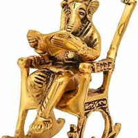 Golden Lord Ganesha Sitting On A Rocking Chair