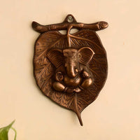 Metal wall hanging of Lord Ganesha on Leaf