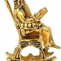 Golden Lord Ganesha Sitting On A Rocking Chair